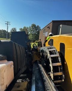 Ledge Creek_Telecom Services_ditch witch machine side view.jpg